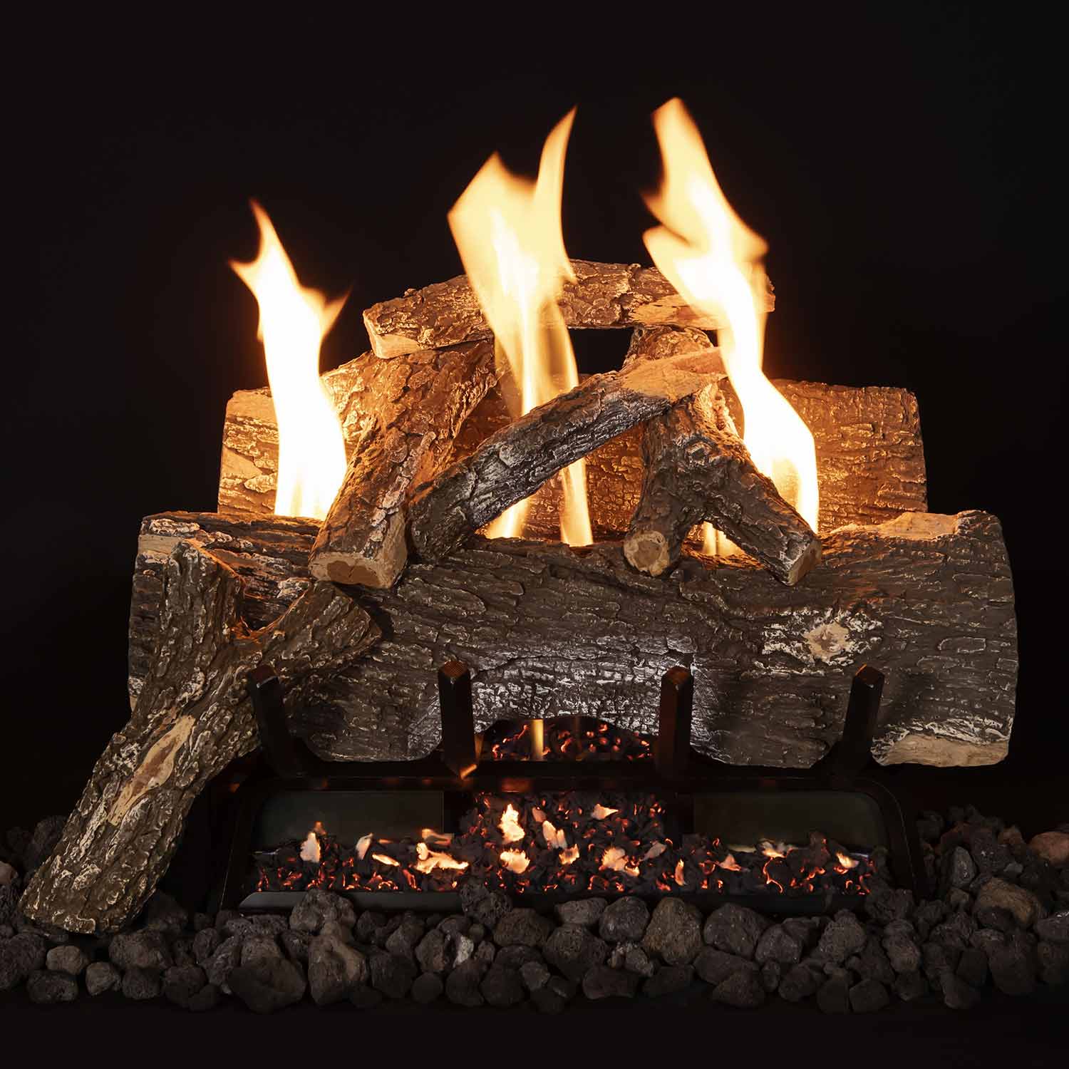 Weathered oak gas logs with burning flames, curved log pieces, and ember bed