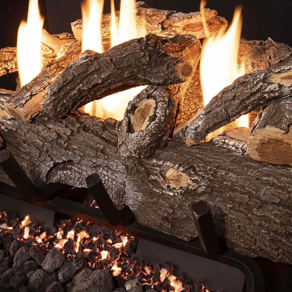 Vent free gas log set close-up of weathered oak logs with flames above burner