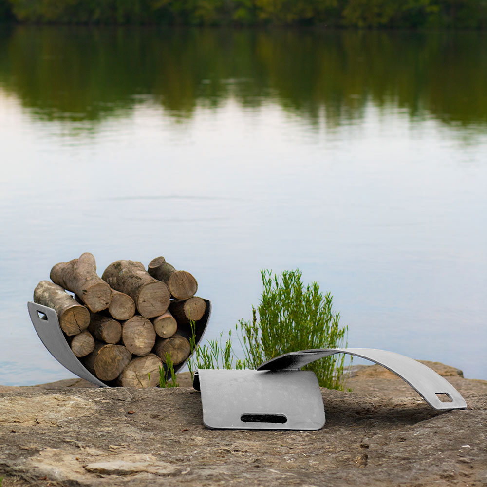 Stainless steel log rack with curved wings holding firewood