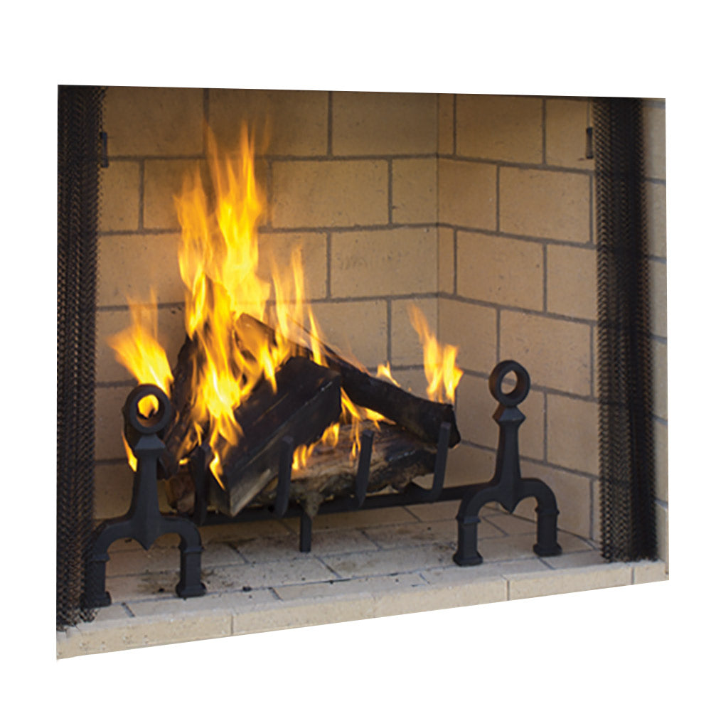 Outdoor masonry wood burning fireplace with black firebox and burning logs.