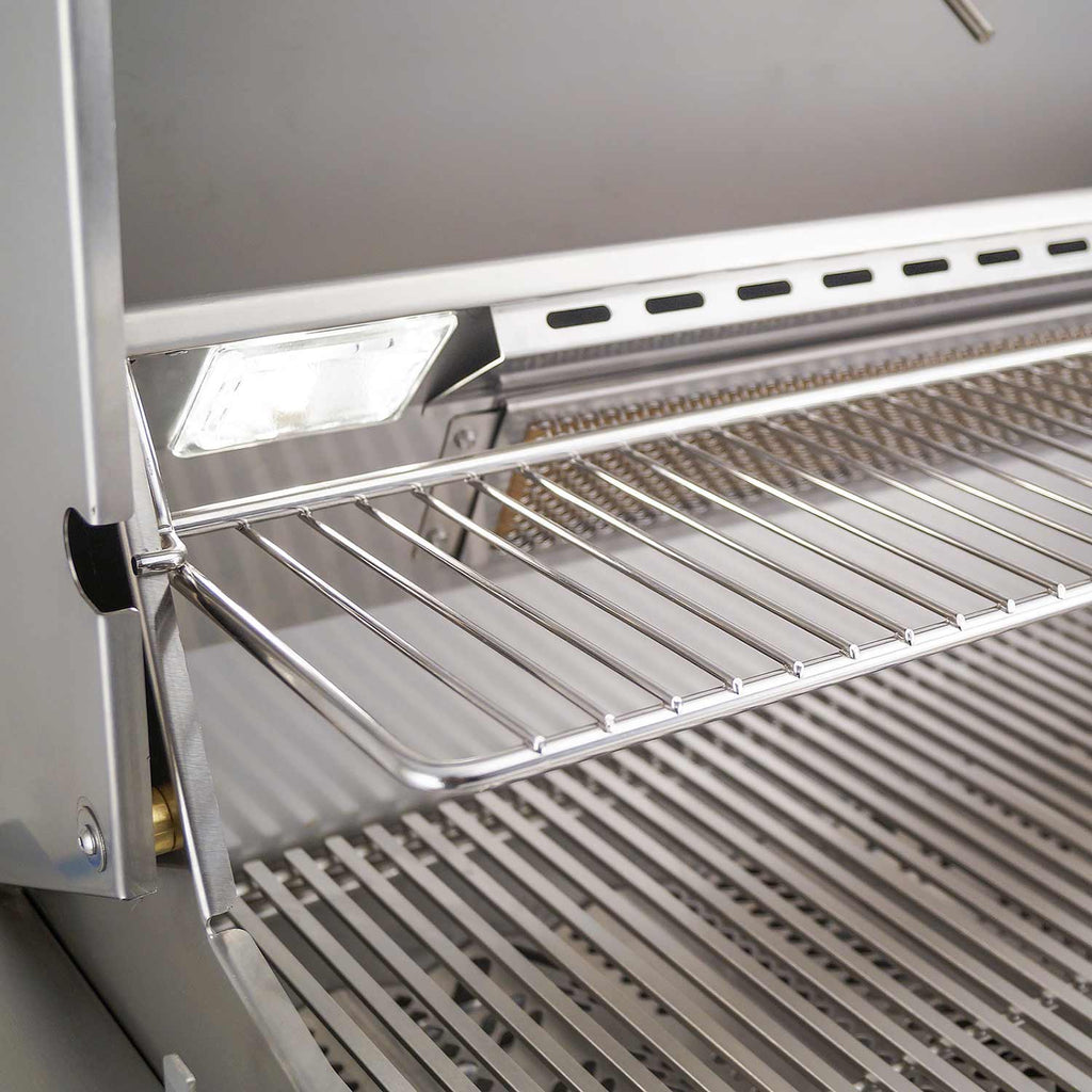 Stainless warming rack above cooking grates with integrated side light