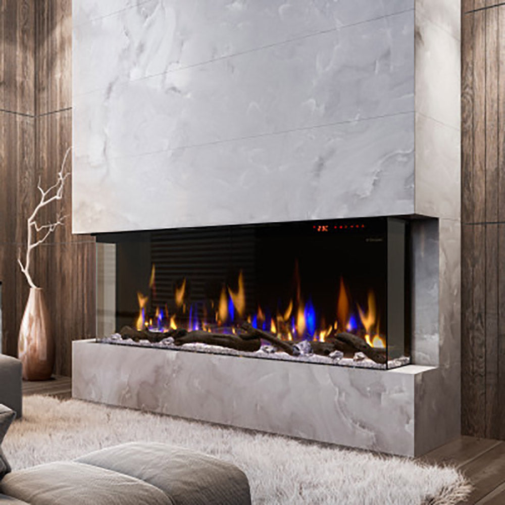 Linear electric fireplace insert in a white stone surround, showing multicolor flame effect