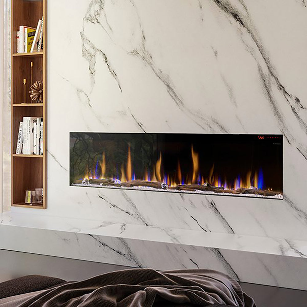 Built-in linear electric fireplace in a wall opening with flame and ember bed inside.