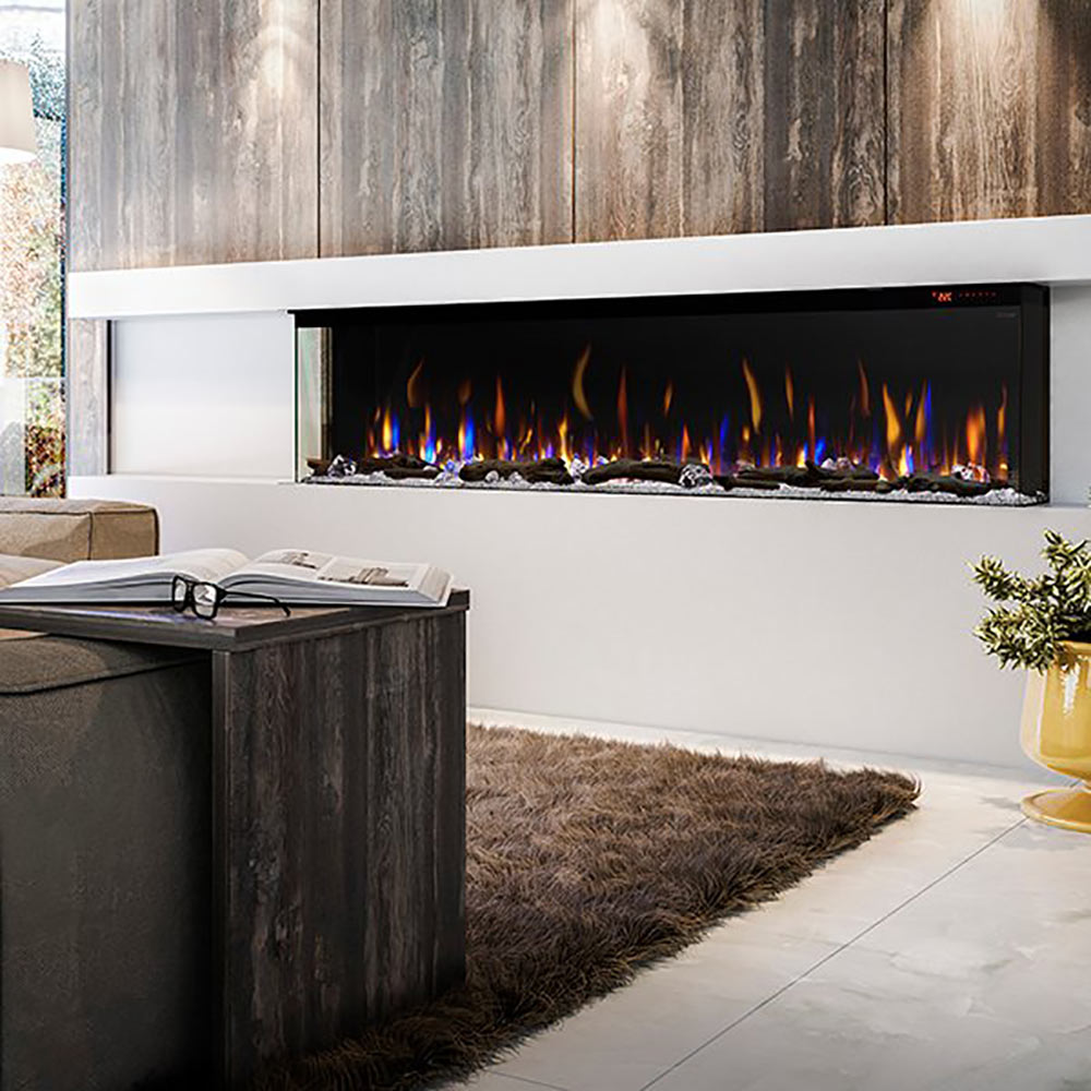 Linear electric fireplace with dark frame, ember bed, and multi-flame display in a wall.