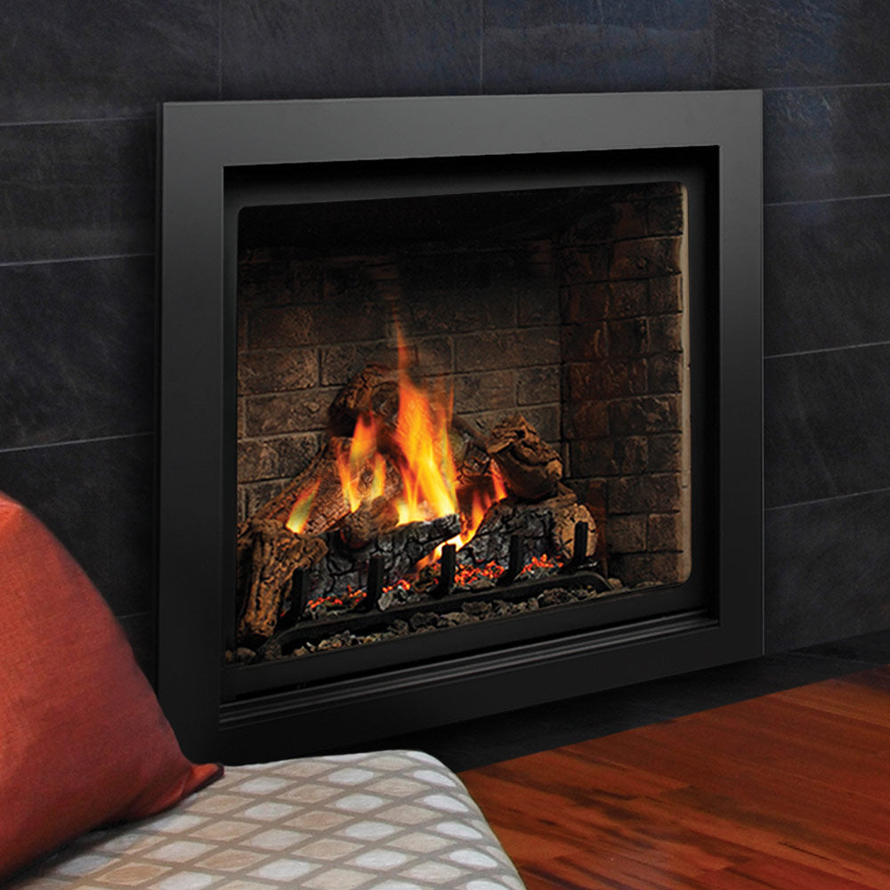 Direct vent gas fireplace with black trim, burning logs inside stone surround