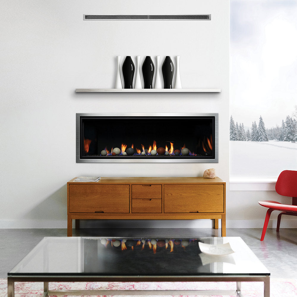 Linear direct vent gas fireplace with black frame, flames and round fire glass pieces