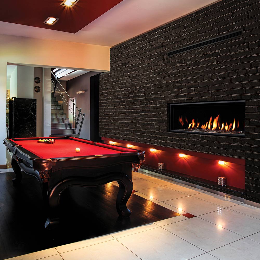 Linear direct vent gas fireplace in black brick surround, flames with ember lighting