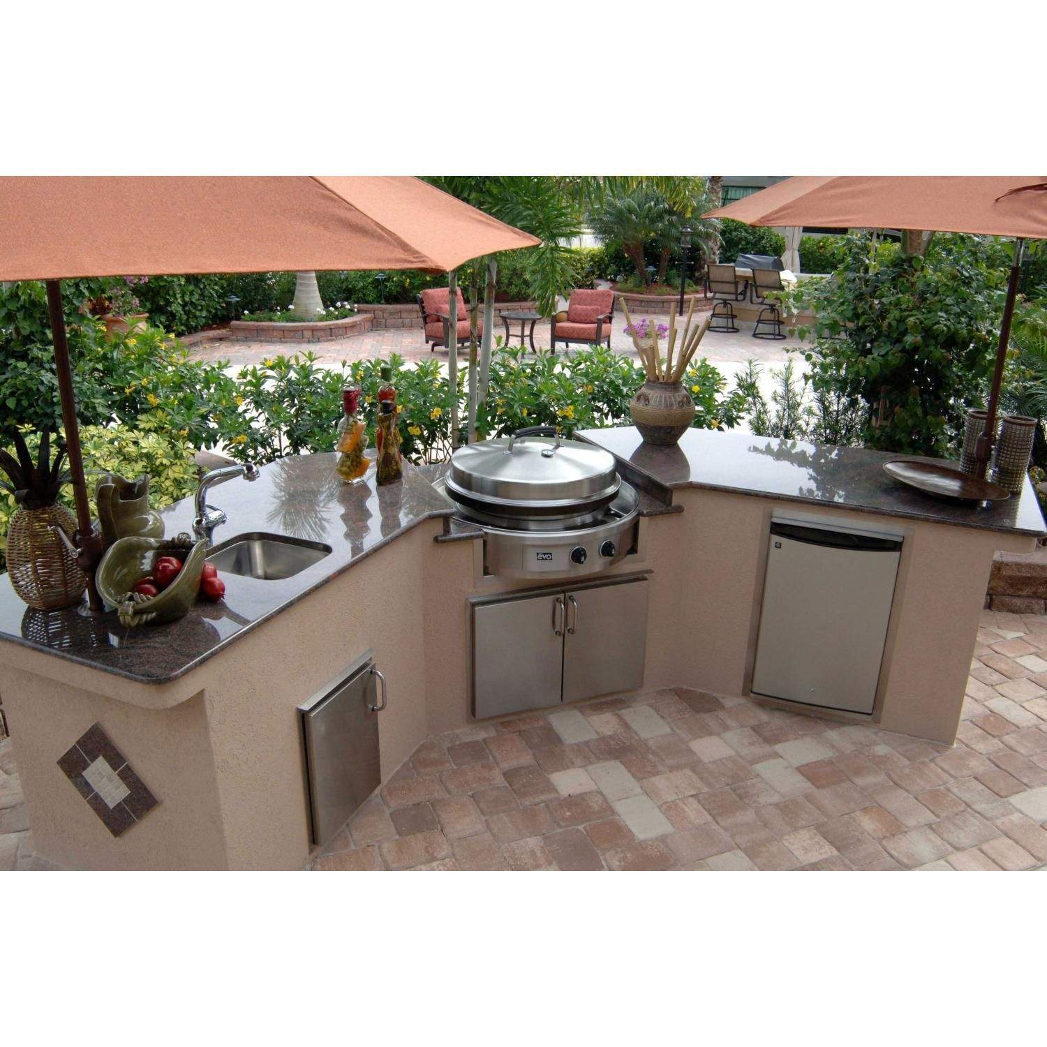 Stainless steel built-in gas grill on outdoor countertop with two front control knobs