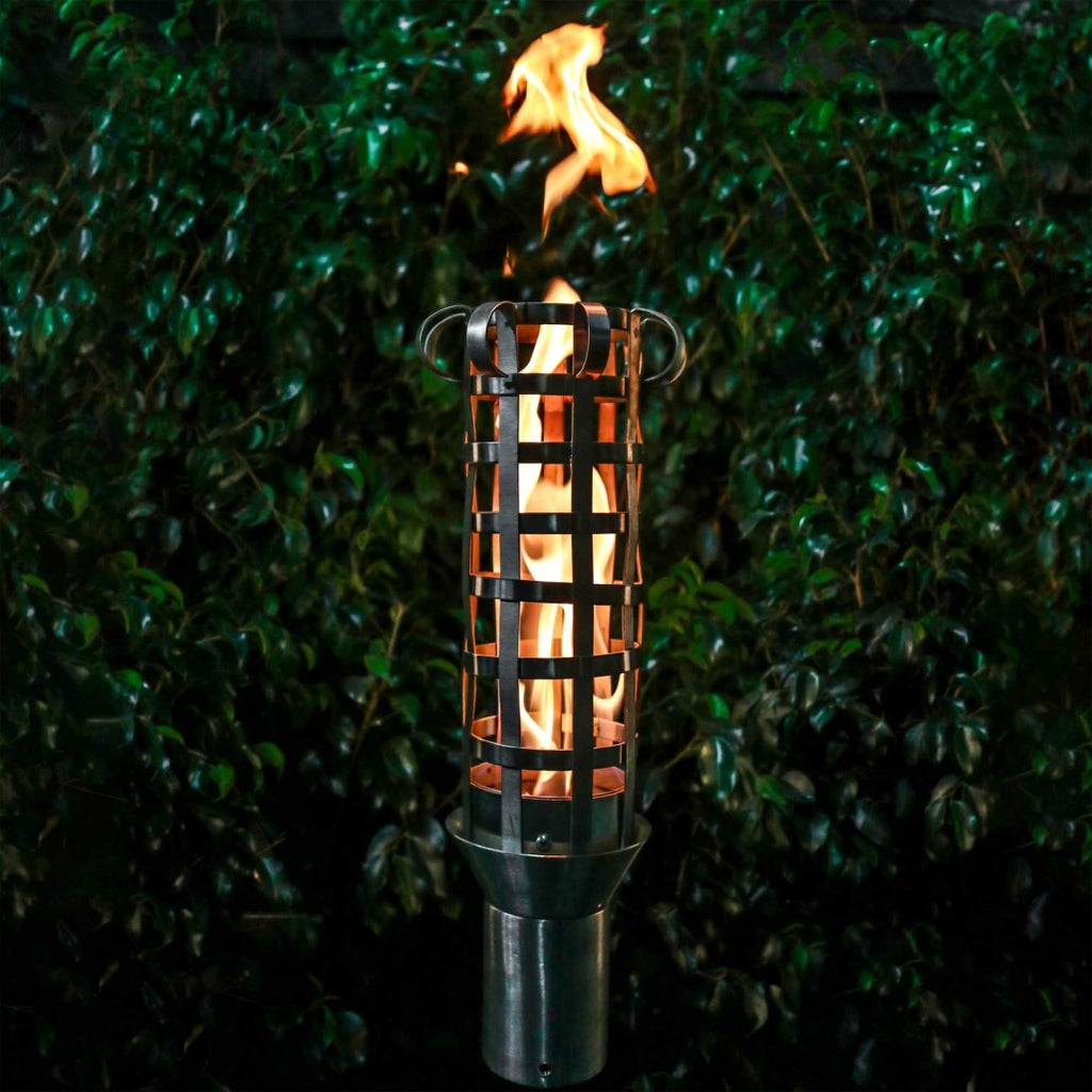 Outdoor torch with metal stand and burning flame