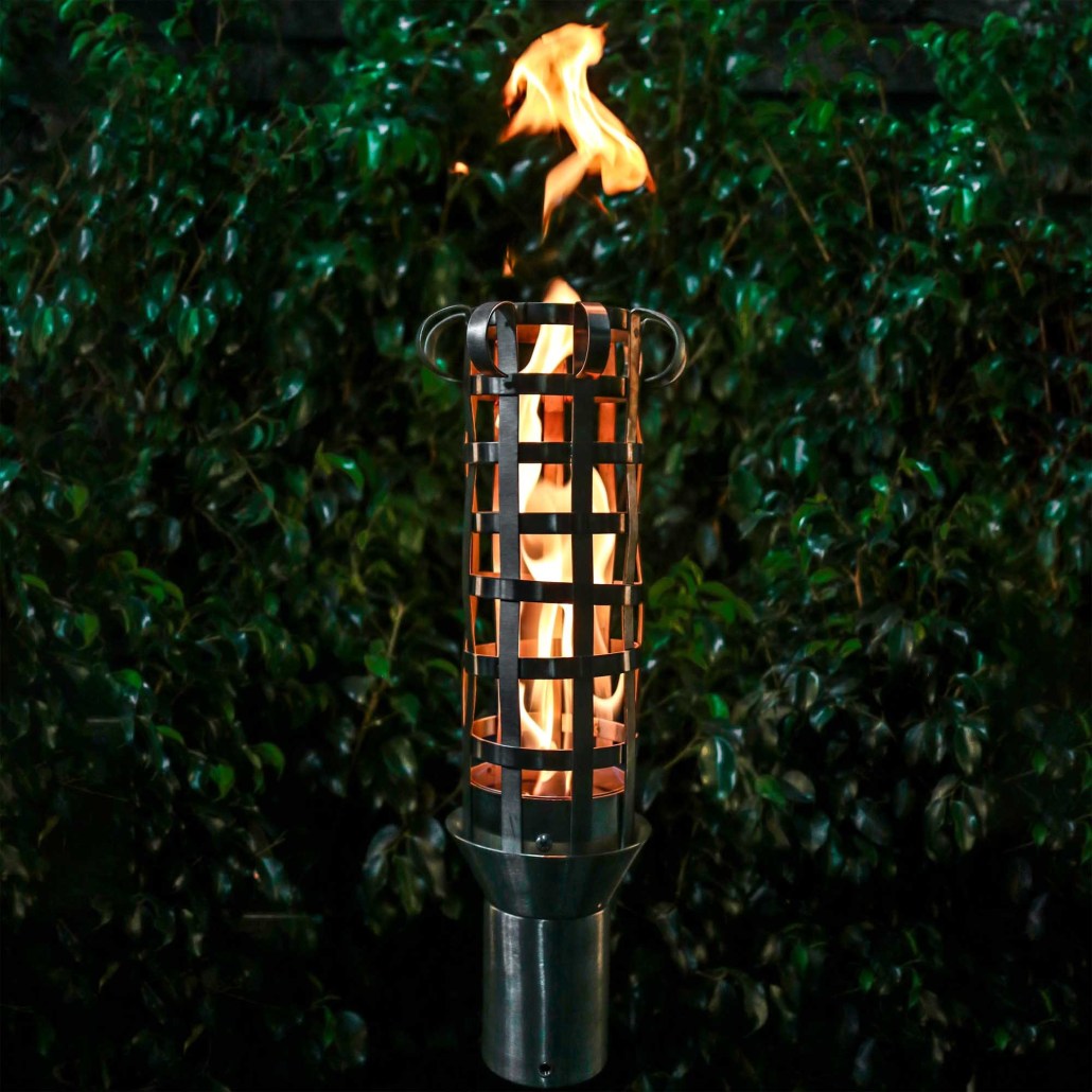 Outdoor torch with metal stand and burning flame