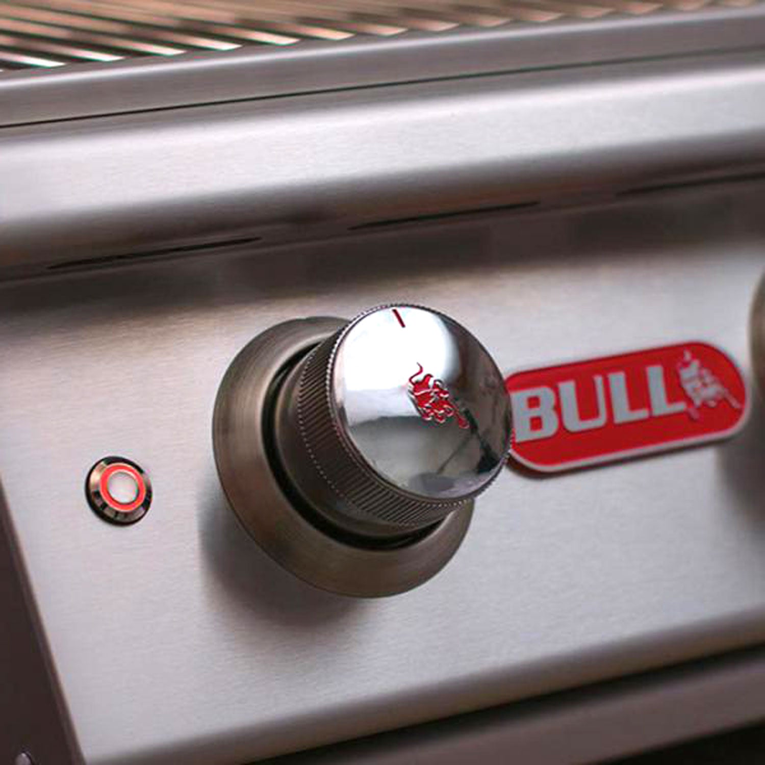 Stainless steel control knob with red BULL emblem and small indicator light