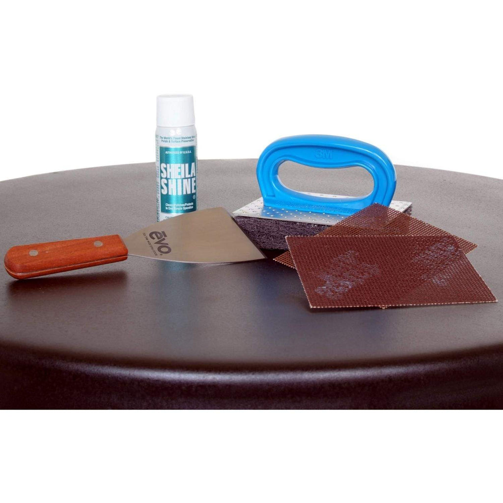 Gas grill cleaning kit with scrub pads, orange tool, blue handle, and bottle