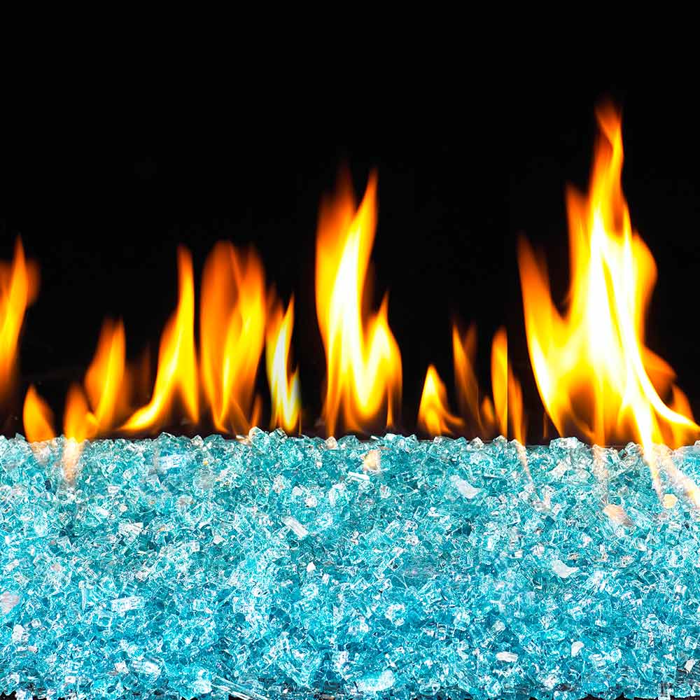 Blue fire glass bed with orange flames burning above