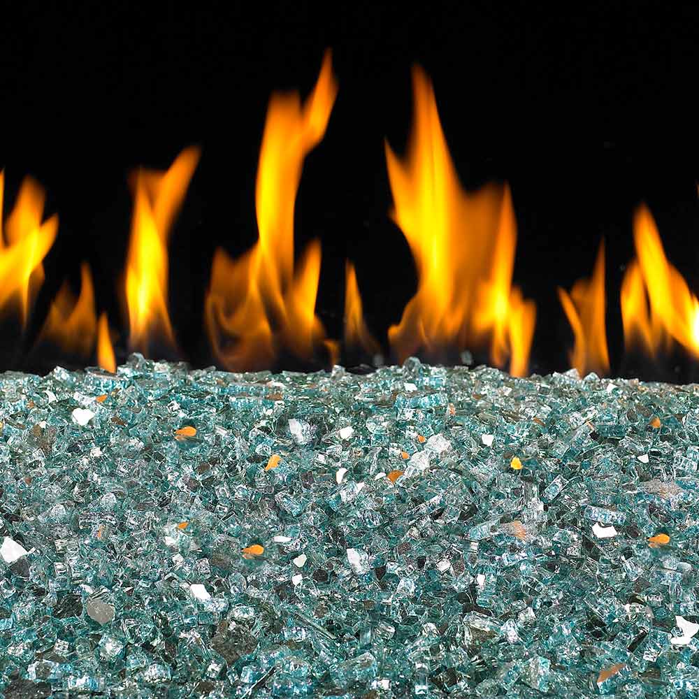 Reflective fire glass bed with teal and blue glass pieces