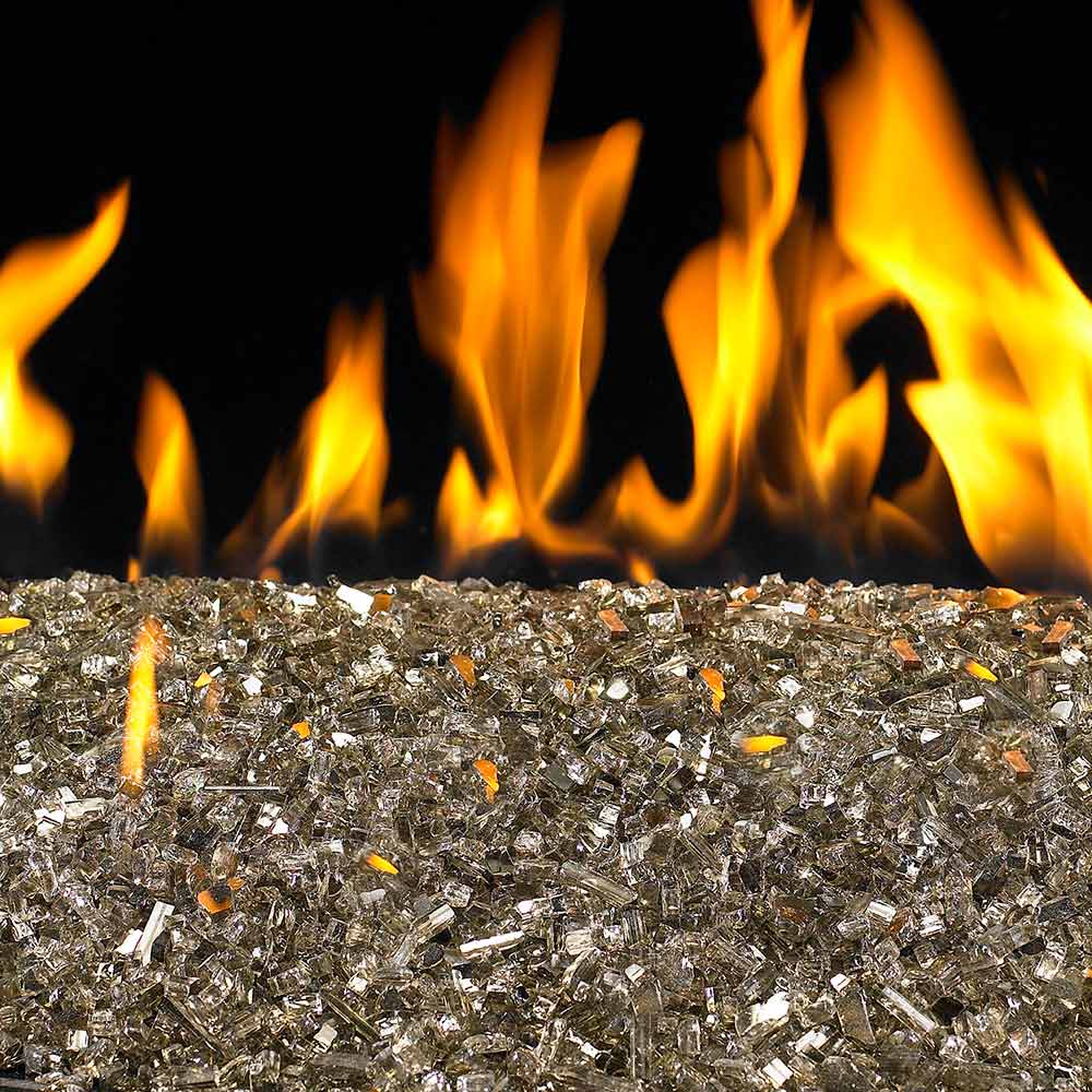 Reflective fire glass stones with orange flames behind