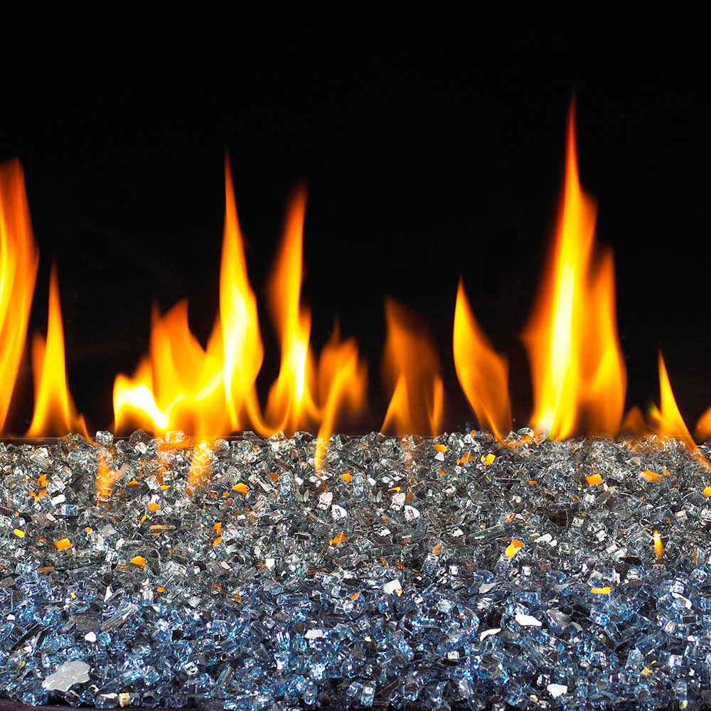 Reflective blue fire glass bed with small glowing flames above