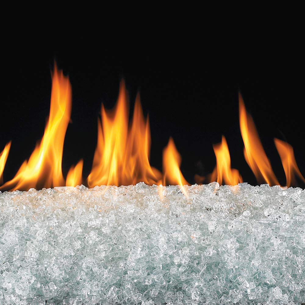 Clear fire glass with flames rising in a fire pit