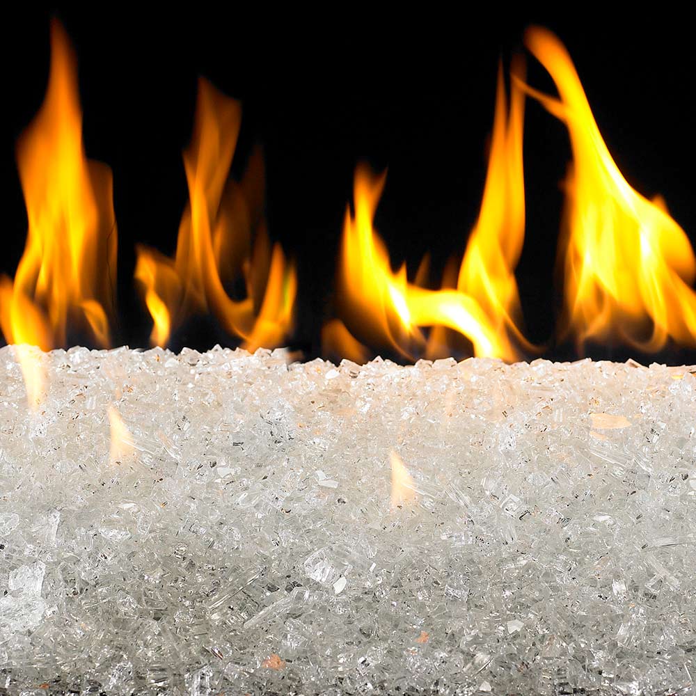Fire glass chunks with flames around a glass bed