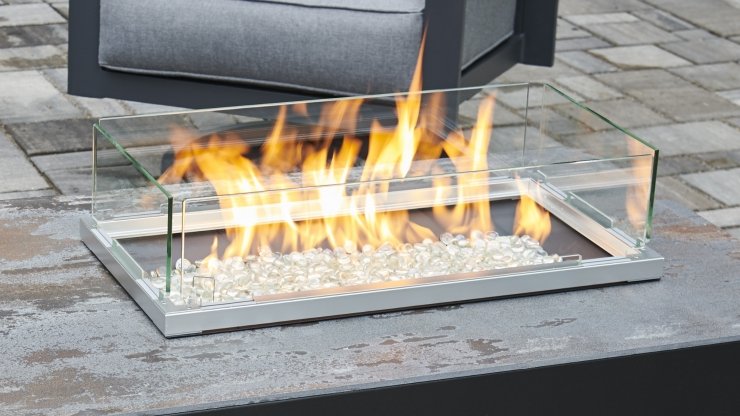 Folding clear glass fire guard with light gray metal base, partially open