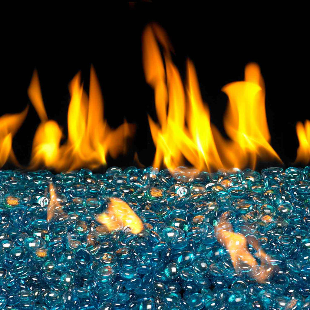 Blue glass fire pit gems with orange flames beneath