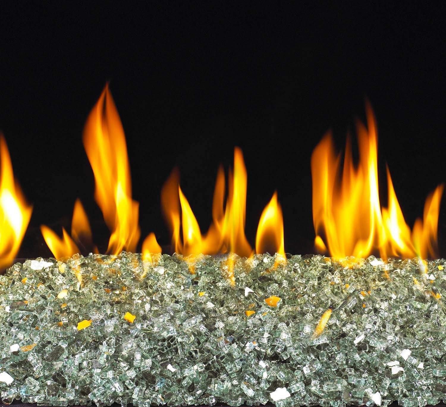 Vent-free glass burner with glowing flames over silver reflective glass media bed