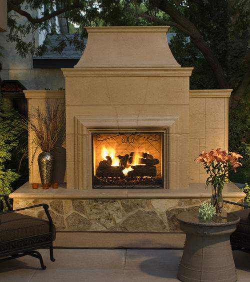 Fireplace screen with black metal frame in front of burning log fireplace opening