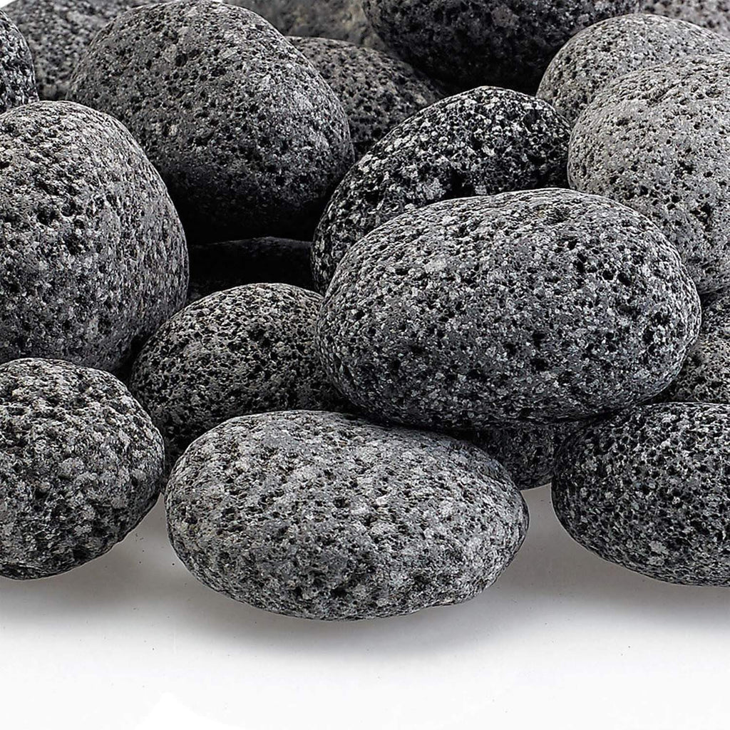 Close-up of gray lava rocks with coarse speckled texture on small oval stones