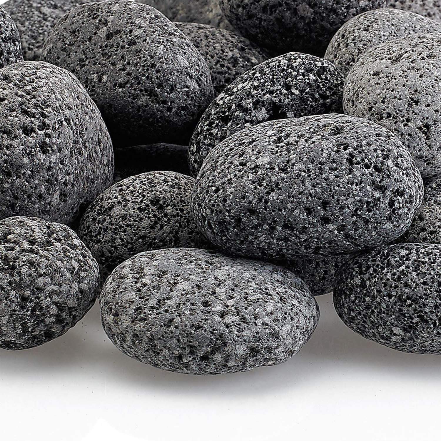 Close-up of gray lava rocks with coarse speckled texture on small oval stones