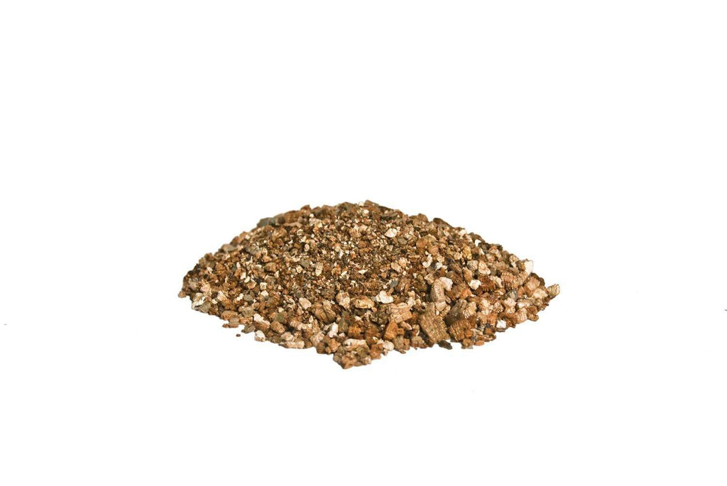 Brown vermiculite granules mound of loose, rock-like particles