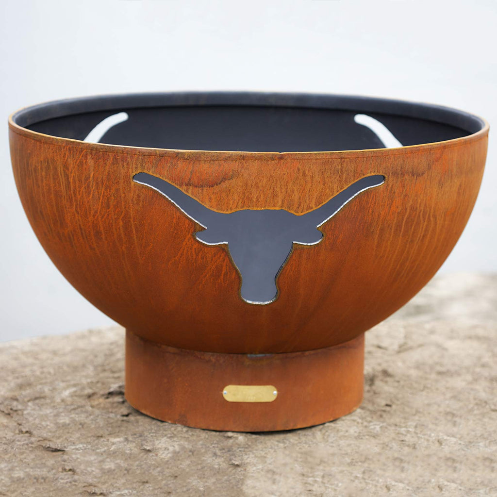 Brown steel gas fire pit bowl with longhorn cutout and flames in the basin