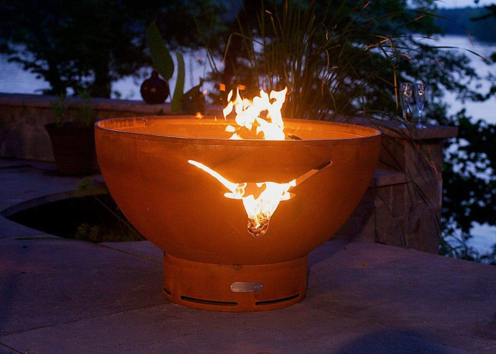 Orange gas fire pit bowl with longhorn emblem, flames rising above the rim