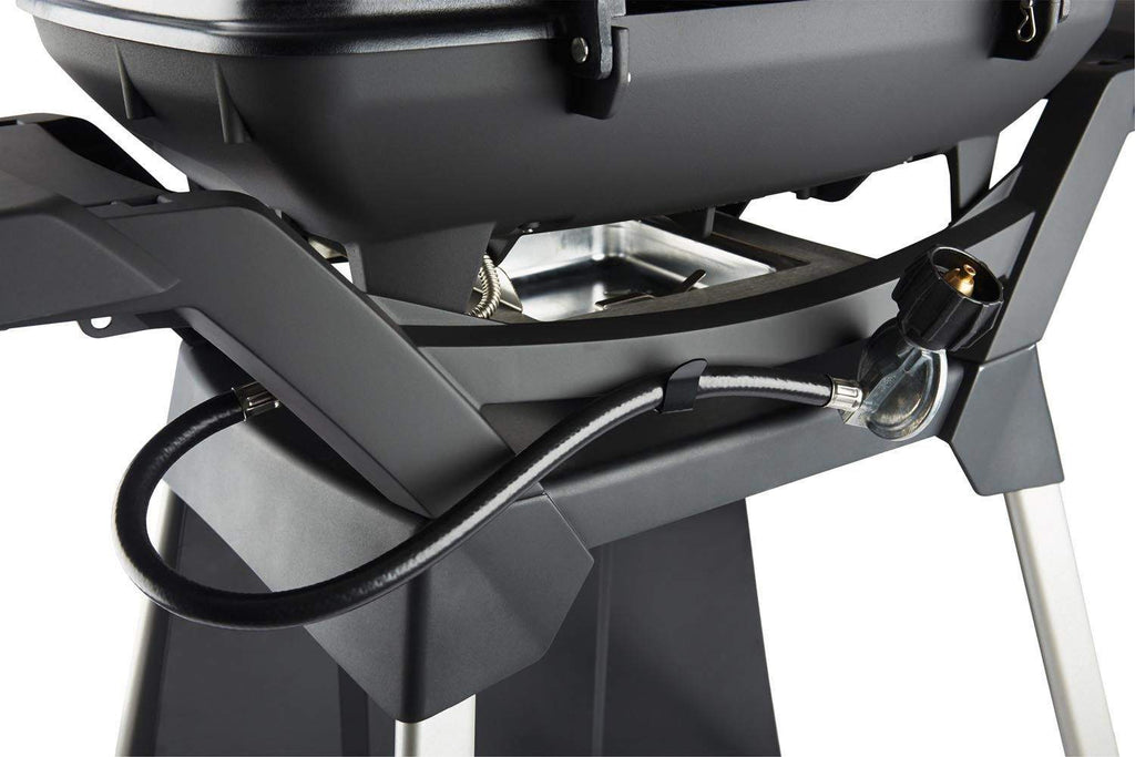 Gas grill cart close-up: black hose and valve/regulator near grill base