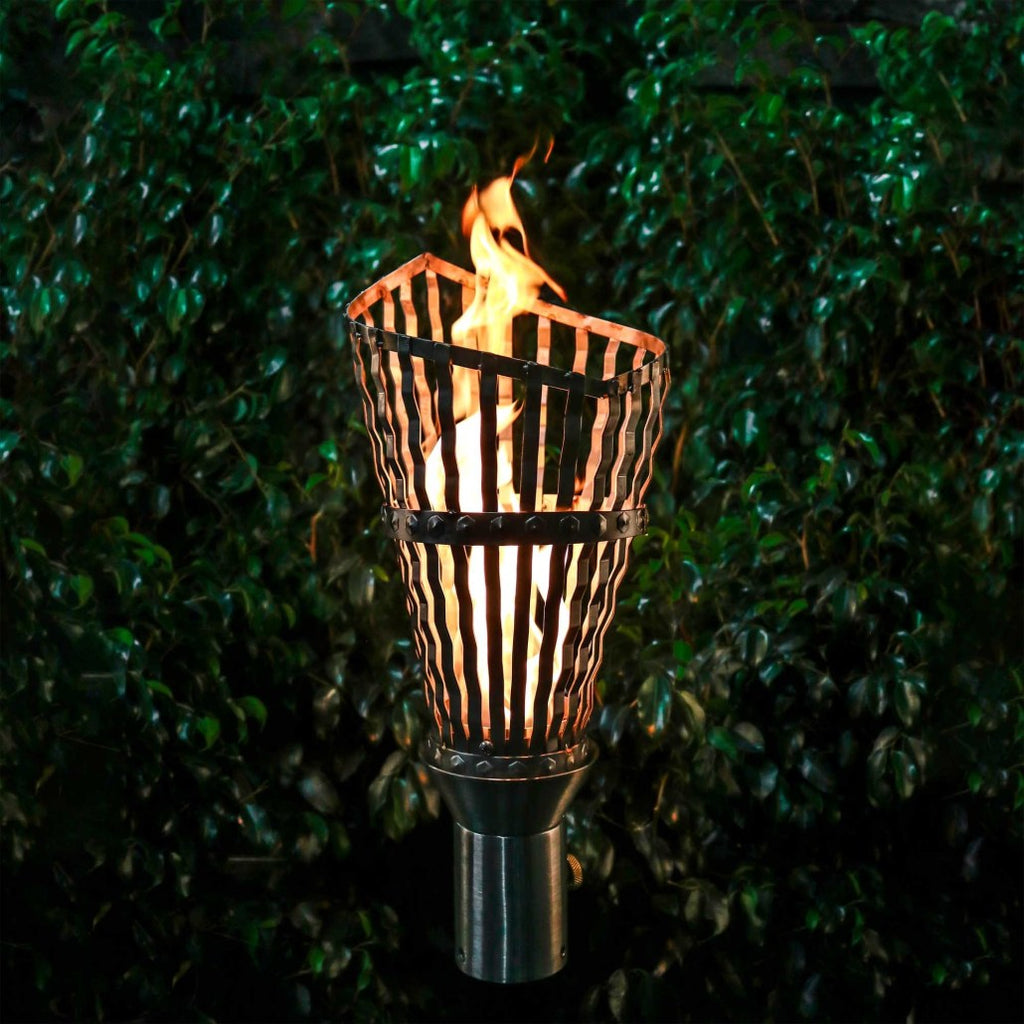 Roman torch with stand, burning flame in ribbed metal cup