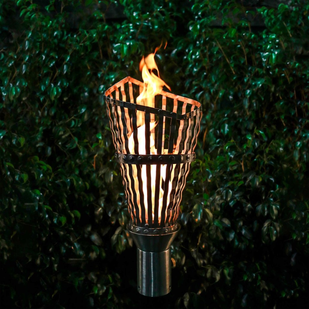 Roman torch with stand, burning flame in ribbed metal cup