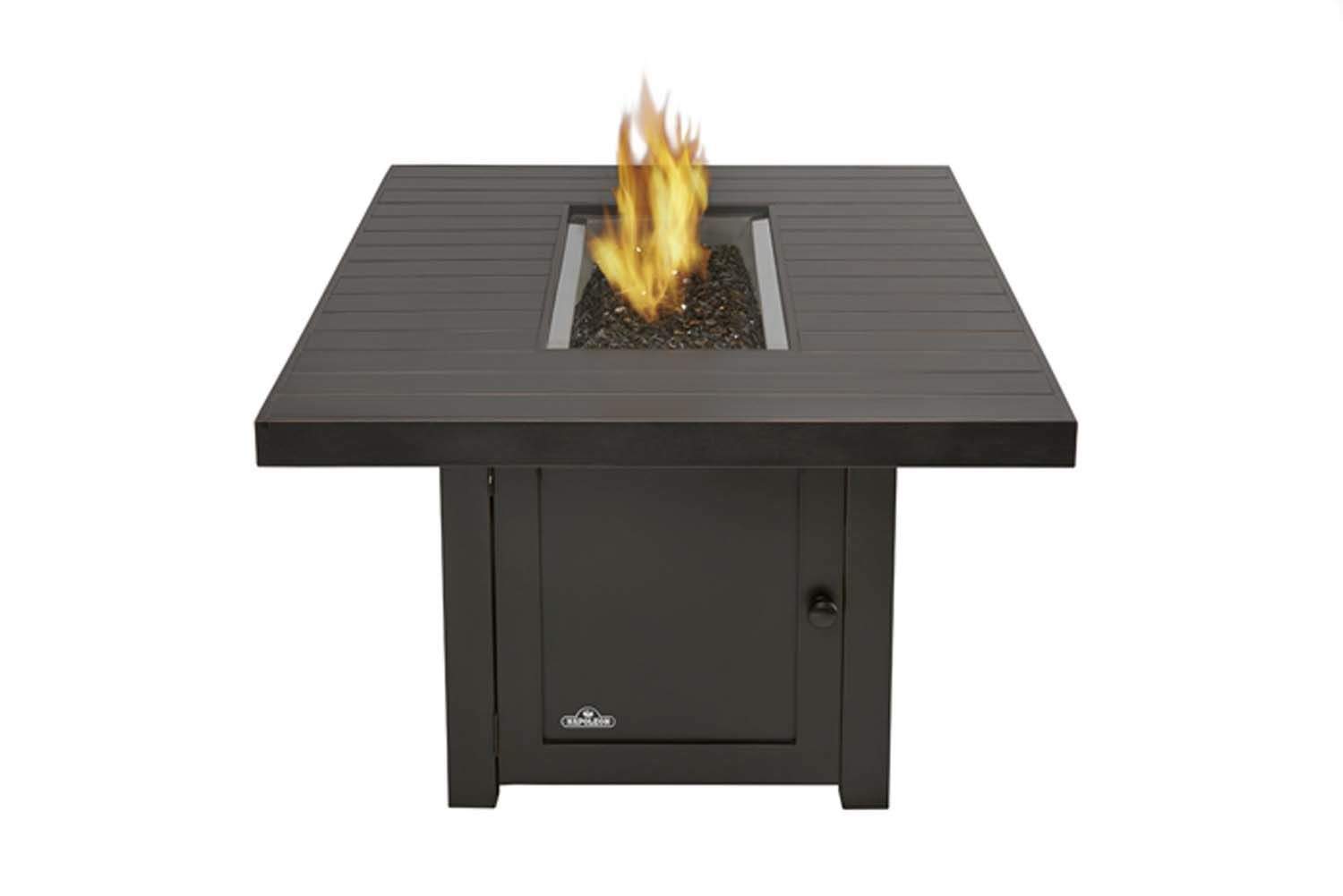 Rectangular patio fire table with square burner opening and flames rising from rocks