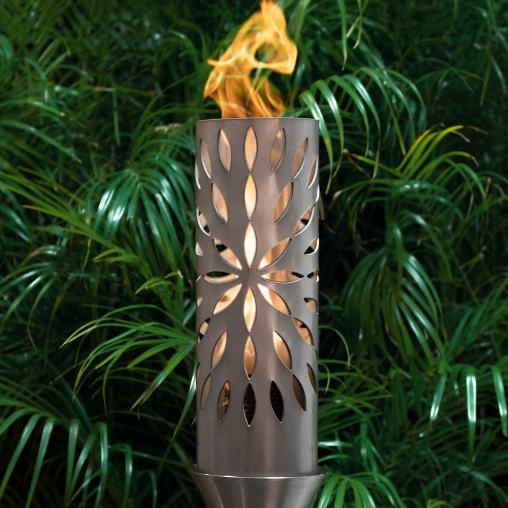 Outdoor propane fire torch with metal stand, leaf-cutout pattern and flame on top