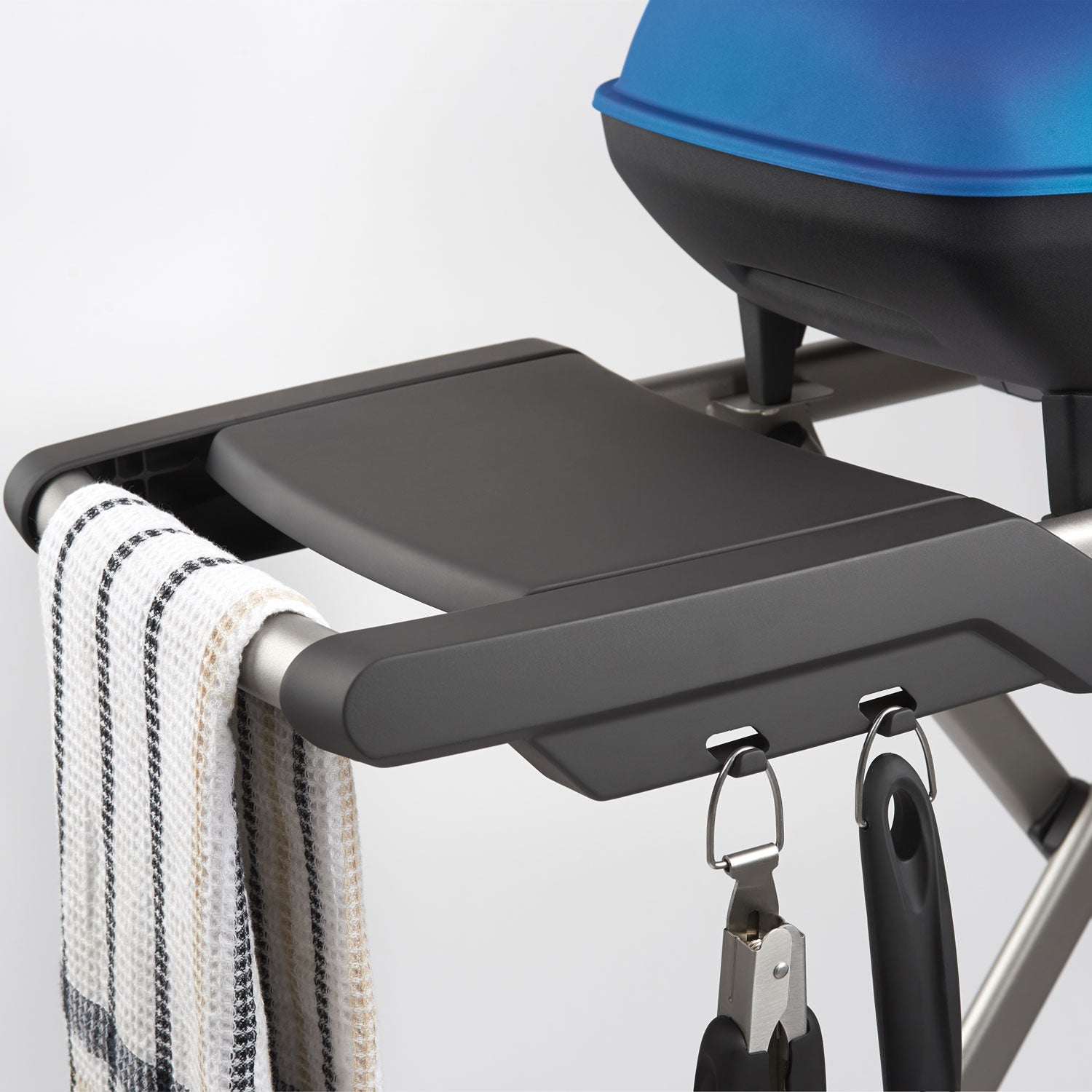 Portable propane grill side shelf with hanging hooks and black ignition knobs