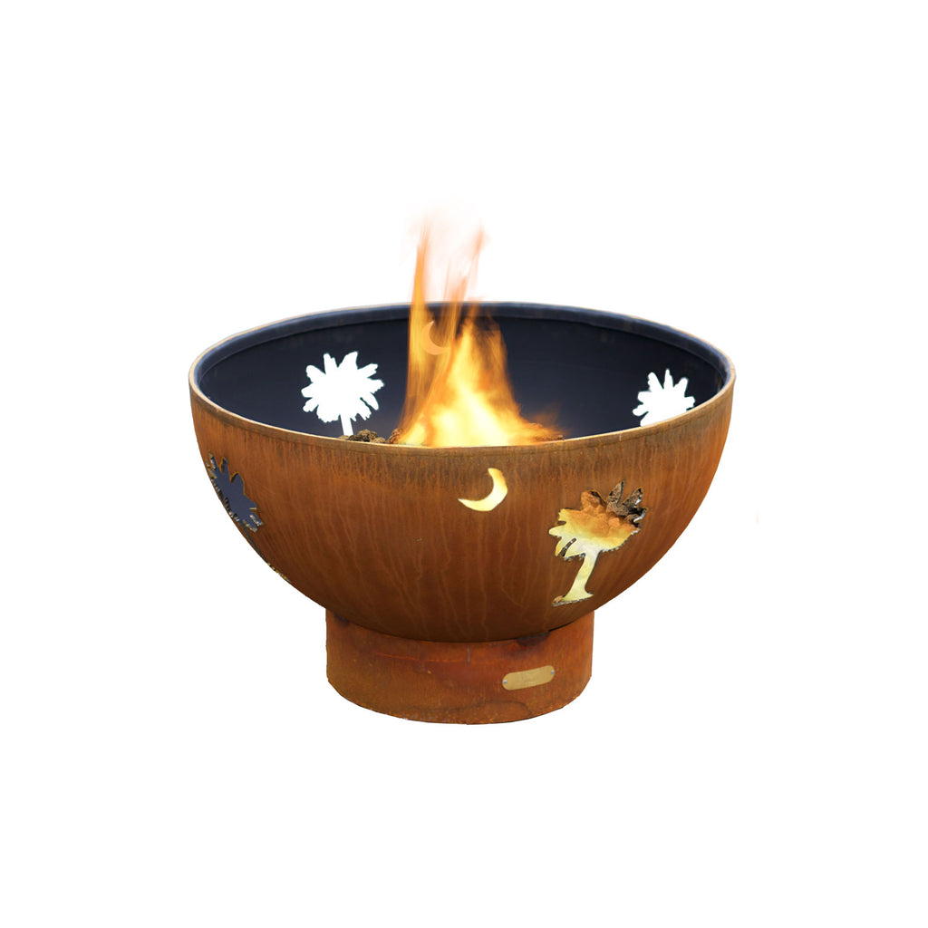Gas fire pit bowl in bronze with decorative moon and palm flame screen