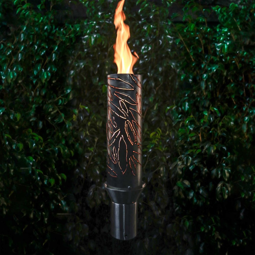 Metal outdoor torch with flame and etched cylinder body, standing on dark base